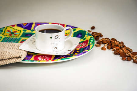 Cup of black coffee and nuts in the breakfastの写真素材