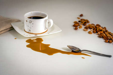 Spilled coffee stain on the table during the breakfast.の写真素材