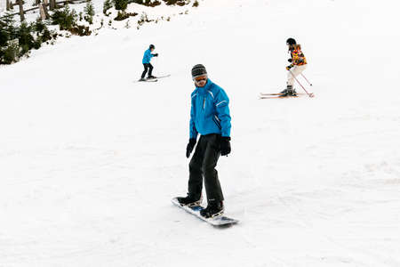Bansko, Bulgaria - December 29, 2015: People are skiing and snowboarding in Bansko ski resortのeditorial素材
