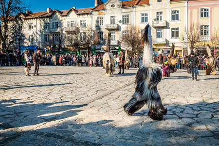 Razlog, Bulgaria - January 01, 2016: People in costumes are taking part in the festival of Mummers in Razlog, Bulgaria. Games, dances and activities are organized for viewers.のeditorial素材