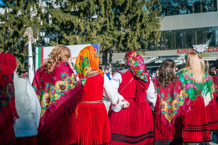 Razlog, Bulgaria - January 01, 2016: Women in costumes are taking part in the festival of Mummers in Razlog, Bulgaria. Games, dances and activities are organized for viewers.のeditorial素材