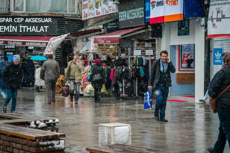 Istanbul, Turkey - January 18, 2016: People are walking on the street and talking on cell phones...