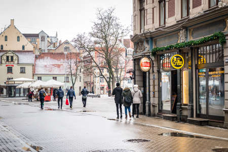 Riga, Latvia - February 20, 2016: People are walking in downtown Riga on Kalku street in Latvia.