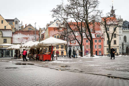 Riga, Latvia - February 20, 2016: People are walking in downtown Riga on Livu square in Latvia.のeditorial素材