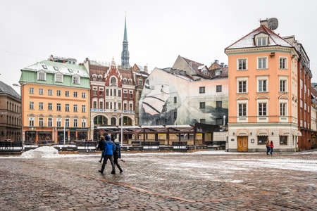 Riga, Latvia - February 20, 2016: People are walking in the Dome Square where Dome Cathedral is located, old city of Rigaのeditorial素材