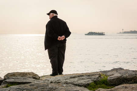 Istanbul, Turkey - January 21, 2015: Man is standing on the coast of the Bosphorus in Istanbulのeditorial素材