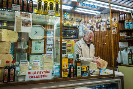 Istanbul, Turkey - March 10, 2015: Man is selling cheese and other organic products in the Market in Istanbul, Turkeyのeditorial素材
