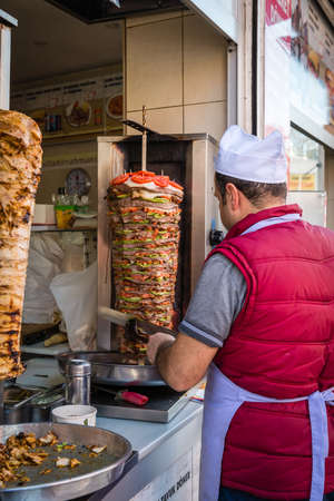 Istanbul, Turkey - March 10, 2015: Man is cooking rotary or doner on the street in Istanbul, Turkeyのeditorial素材