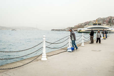 Istanbul, Turkey - March 24, 2016: People are fishing in the Bosphorus, Uskudar in Istanbul, Turkeyのeditorial素材