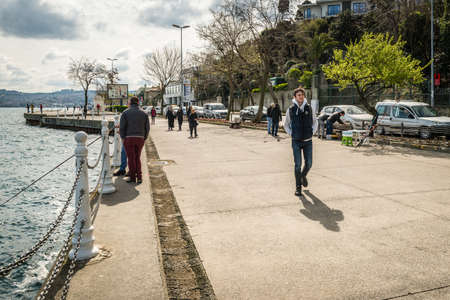 Istanbul, Turkey - March 27, 2016: People are walking and fishing on the coastline of Tarabya, Istanbul, Turkeyのeditorial素材