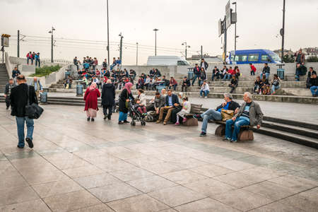 Istanbul, Turkey - April 08, 2016: People are sitting and resting in Eminonu near of the Galata bridge in Istanbul, Turkeyのeditorial素材