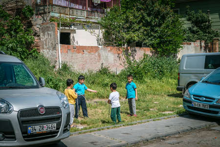 Istanbul, Turkey - April 20, 2016: Turkish children are playing on the street between cars in Istanbul, Turkeyのeditorial素材