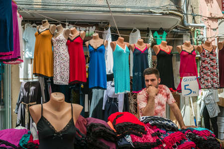 Istanbul, Turkey - April 20, 2016: Man is selling women nightdresses in the market in Istanbul, Turkeyのeditorial素材
