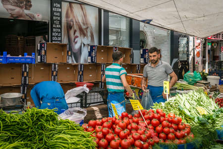 Istanbul, Turkey - April 20, 2016: Man is selling vegetables in the market in Istanbul, Turkeyのeditorial素材