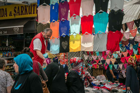Istanbul, Turkey - April 20, 2016: Man is selling women t shirts in the market in Istanbul, Turkey