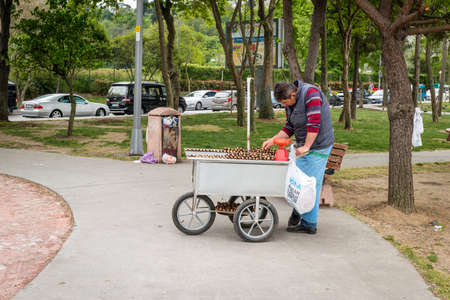 Istanbul, Turkey - April 23, 2016: Local street seller is selling chestnuts in Uskudar, Istanbulのeditorial素材
