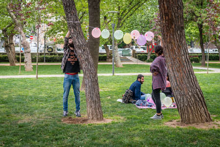 Istanbul, Turkey - April 23, 2016: Young people are hanging balloons for games in the Yogurtcu park in Istanbul, Turkeyのeditorial素材