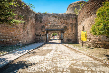Iznik, Turkey - July 24, 2016: Turkish couple is passing through Istanbul gate of Nicea ancient city in Iznik, Turkeyのeditorial素材