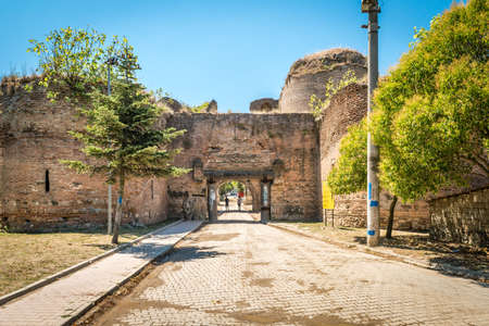 Iznik, Turkey - July 24, 2016: Turkish couple is passing through Istanbul gate of Nicea ancient city in Iznik, Turkeyのeditorial素材