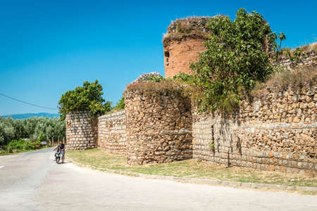 Iznik, Turkey - July 24, 2016: Father and son are passing by walls of Yenisehir gate of Nicea Ancient City, Iznikのeditorial素材