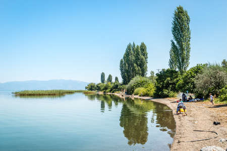 Iznik, Turkey - July 24, 2016: People are resting near the lake of Iznik in Turkeyのeditorial素材