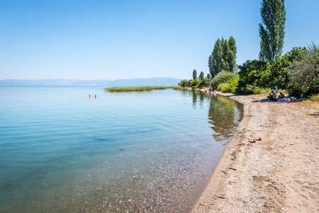 Iznik, Turkey - July 24, 2016: People are resting near the lake of Iznik in Turkeyのeditorial素材