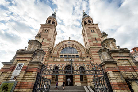 Sibiu, Romania - September 18, 2016: People are passing by Holy Trinity Romanian Orthodox Cathedral Sibiu, Romaniaのeditorial素材