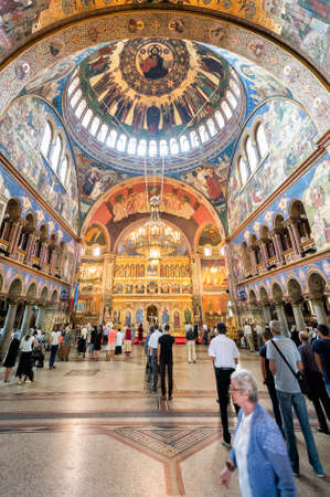 Sibiu, Romania - September 18, 2016: People are visiting Holy Trinity Romanian Orthodox Cathedral...