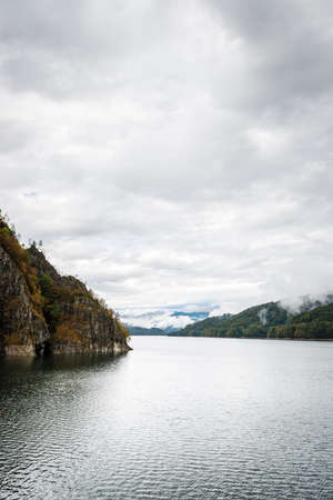 Lake Vidraru created on the dam in Carpathian mountains near Transfagarasan highway in Romaniaの写真素材
