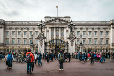 London, United Kingdom - October 17, 2016: People are gethering near Buckingham Palace in London, UK before changing of guards. Buckingham Palace has been the official London residence of Britain's monarchs since 1837.のeditorial素材