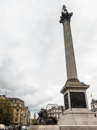London, United Kingdom - October 20, 2016: London Trafalgar Square lion and Big Ben tower at backgroundのeditorial素材