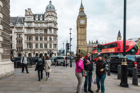 London, United Kingdom - October 20, 2016: People are walking on the streets of London on the background of Big Ben tower in London, Englandのeditorial素材