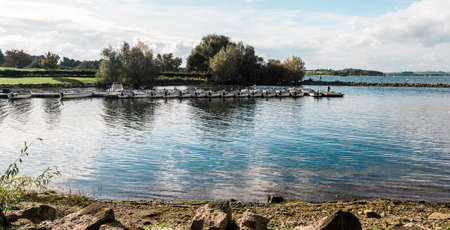 Rutland Water Park, England - October 22, 2016: Boats in the water reservoir in Rutland Water Park, Englandのeditorial素材