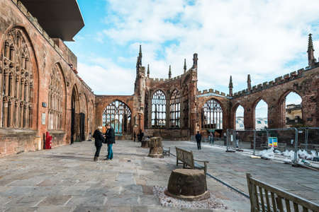 Coventry, England - October 23, 2016: People are visiting the runied Cathedral Church of St Michaelのeditorial素材