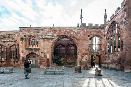 Coventry, England - October 23, 2016: People are visiting the runied Cathedral Church of St Michaelのeditorial素材