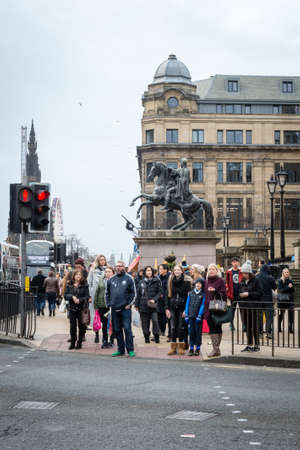 Edinburgh, Scotland - December 30, 2016: People are waiting near the traffic light in Edinburgh, Scotland, UKのeditorial素材