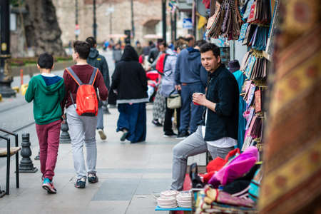 Istanbul, Turkey - April 12, 2017: Shop vendor is  having a tea on the street in Istanbul, Turkeyのeditorial素材