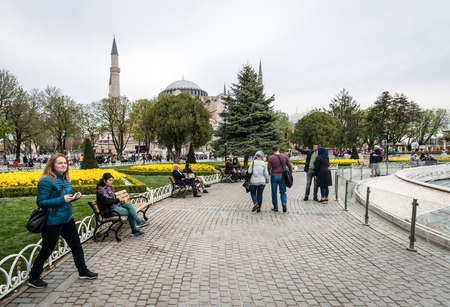 Istanbul, Turkey - April 12, 2017: People are visiting Sultanahmet square near the Hagia Sophia Museum during the Istanbul Tulip festival in April.のeditorial素材
