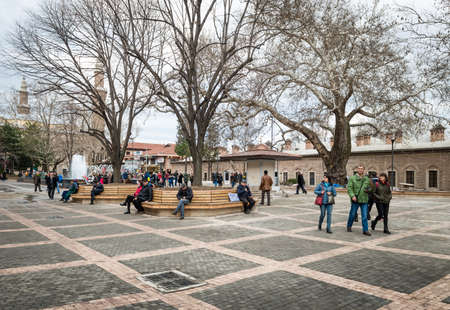 Bursa, Turkey - February 04, 2017: People are walking in the Park near the  Orhan Gazi Mosque (Orhan Camii) in Bursa, Turkeyのeditorial素材