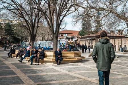 Bursa, Turkey - February 04, 2017: People are walking in the Park near the  Orhan Gazi Mosque (Orhan Camii) in Bursa, Turkeyのeditorial素材