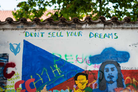 Prague, Czech Republic- July 15, 2017: The John Lennon Wall in 1980's was a symbol of resistance against comunist government, but today it is covered with love quotes and tourist messages to Prague as a symbol of peace and love. Prague, Czech Republic.のeditorial素材