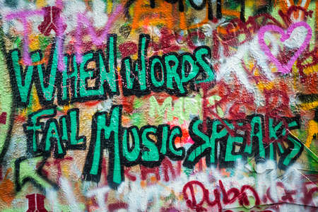 Prague, Czech Republic- July 15, 2017: The John Lennon Wall in 1980's was a symbol of resistance against comunist government, but today it is covered with love quotes and tourist messages to Prague as a symbol of peace and love. Prague, Czech Republic.のeditorial素材