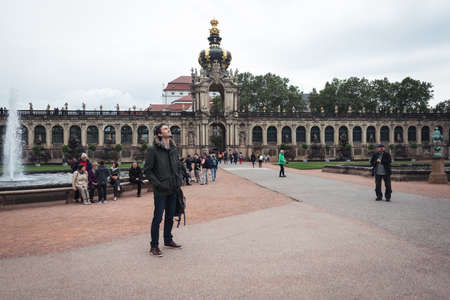 Dresden, Germany- September 16, 2017: Tourists are visiting Zwinger. The Baroque style palace served as an orangery, exhibition gallery and festival arena of the Dresden Court.のeditorial素材