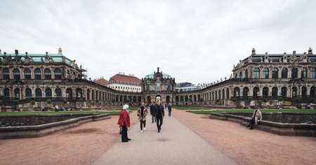 Dresden, Germany- September 16, 2017: Tourists are visiting Zwinger. The Baroque style palace served as an orangery, exhibition gallery and festival arena of the Dresden Court.のeditorial素材
