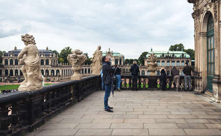 Dresden, Germany- September 16, 2017: Tourists are visiting Zwinger. The Baroque style palace served as an orangery, exhibition gallery and festival arena of the Dresden Court.のeditorial素材