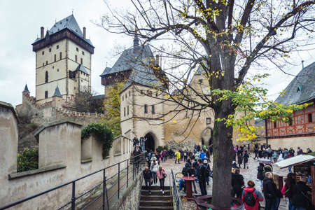 Karlstejn, Czech Republic- October 28, 2017: People are visiting Karlstejn castle in a rainy autumn day. It is one of the most famous and most frequently visited castles in Czech Republic.のeditorial素材