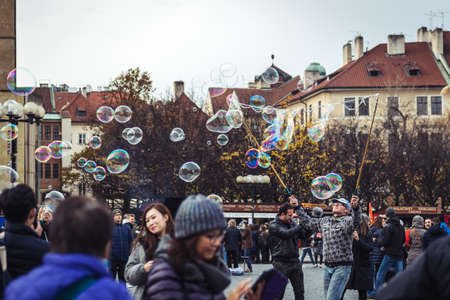 Prague, Czech Republic- November 12, 2017:  Tourist attraction and entertainment with soap bubbles in Old Town Square in Prague, Czech Republicのeditorial素材