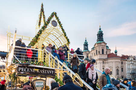 Prague, Czech Republic- December 23, 2017: People are gathering around Christmas decoration in the Prague  market on Old Town Square, Czech Republicのeditorial素材