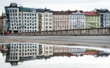 Prague, Czech Republic- December 26, 2017: View from the Jirasek bridge to the Dancing house in...