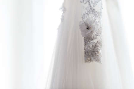 Wedding detail photography. Beautiful white wedding dress. Bridal morning